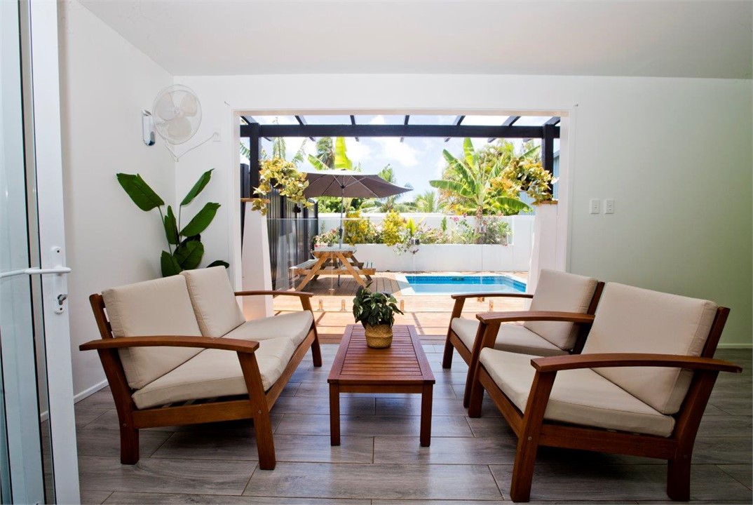 Veranda leading out to swimming pool, decking area