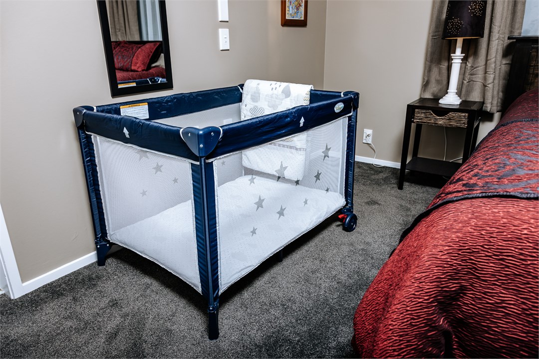 Portacot with Bassinet attachment and bedding upon