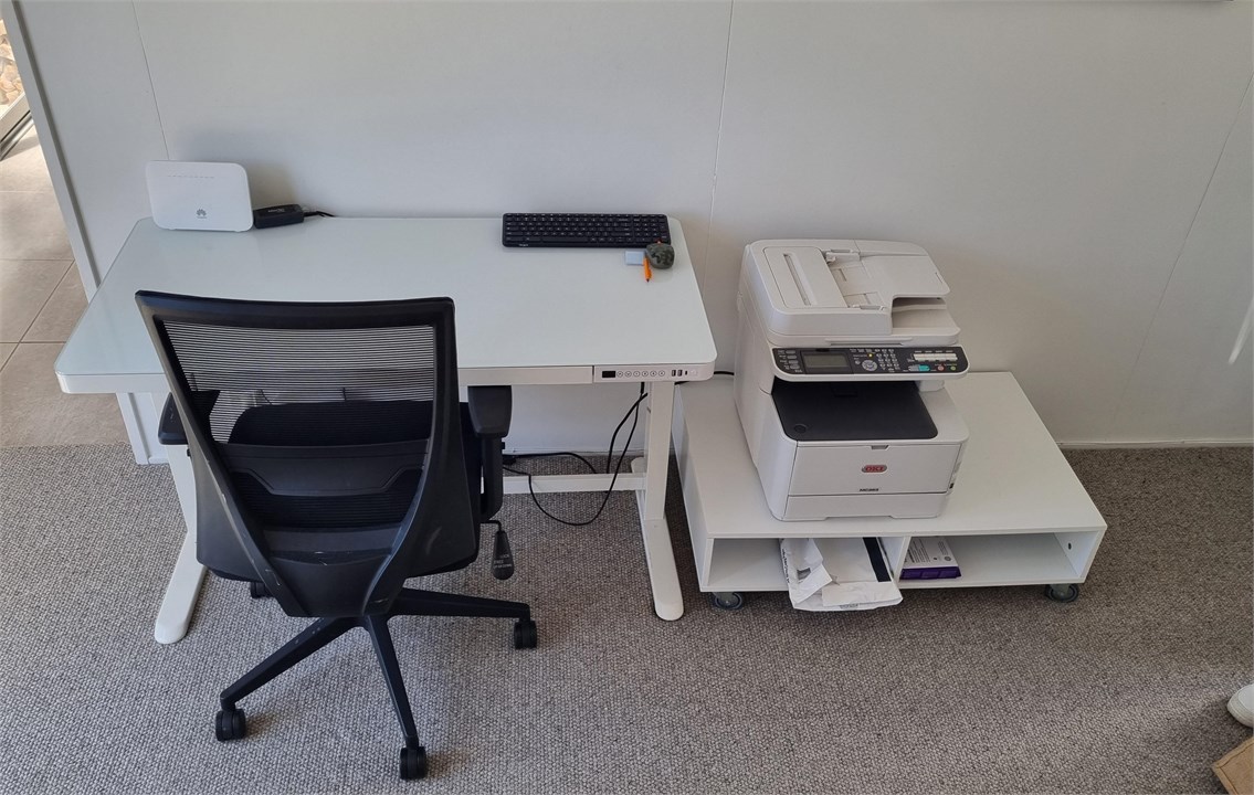 Home office with adjustable / standing desk & prin