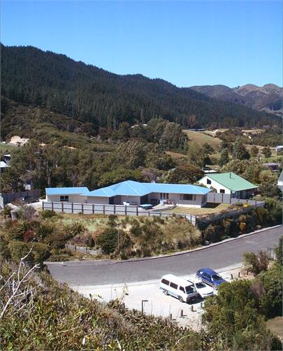 Aerial shot of house, beach just to right