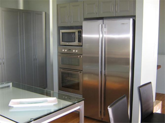Kitchen with Stainless Steel Appliance & Pantry 