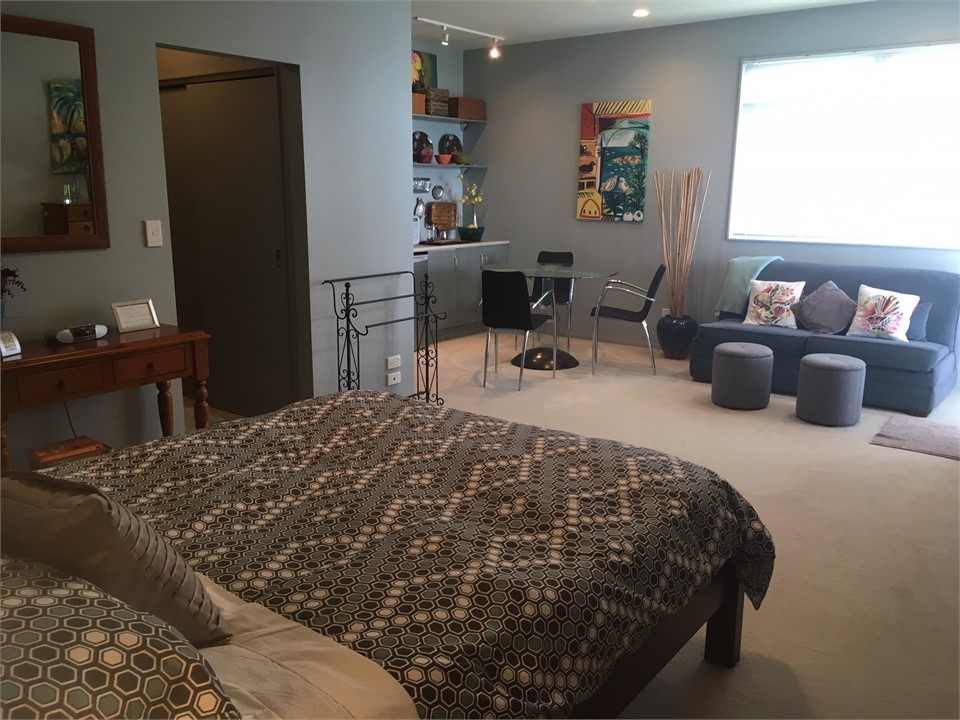 Large Apartment-Size Bedroom with Table & Couch