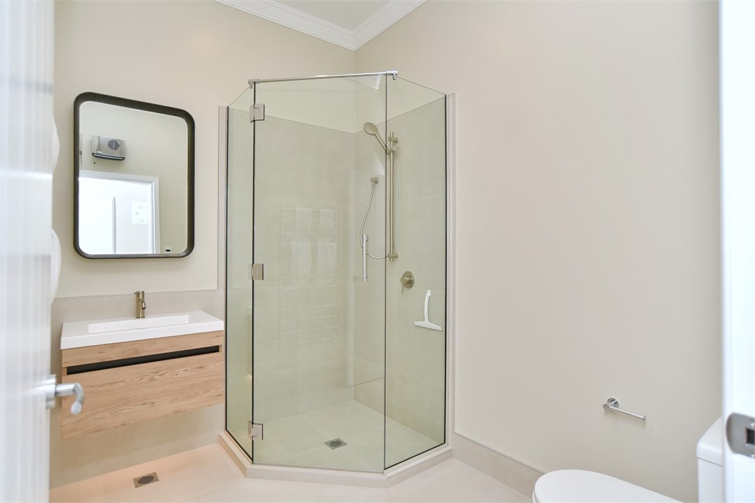 Bathroom has a shower and a toilet