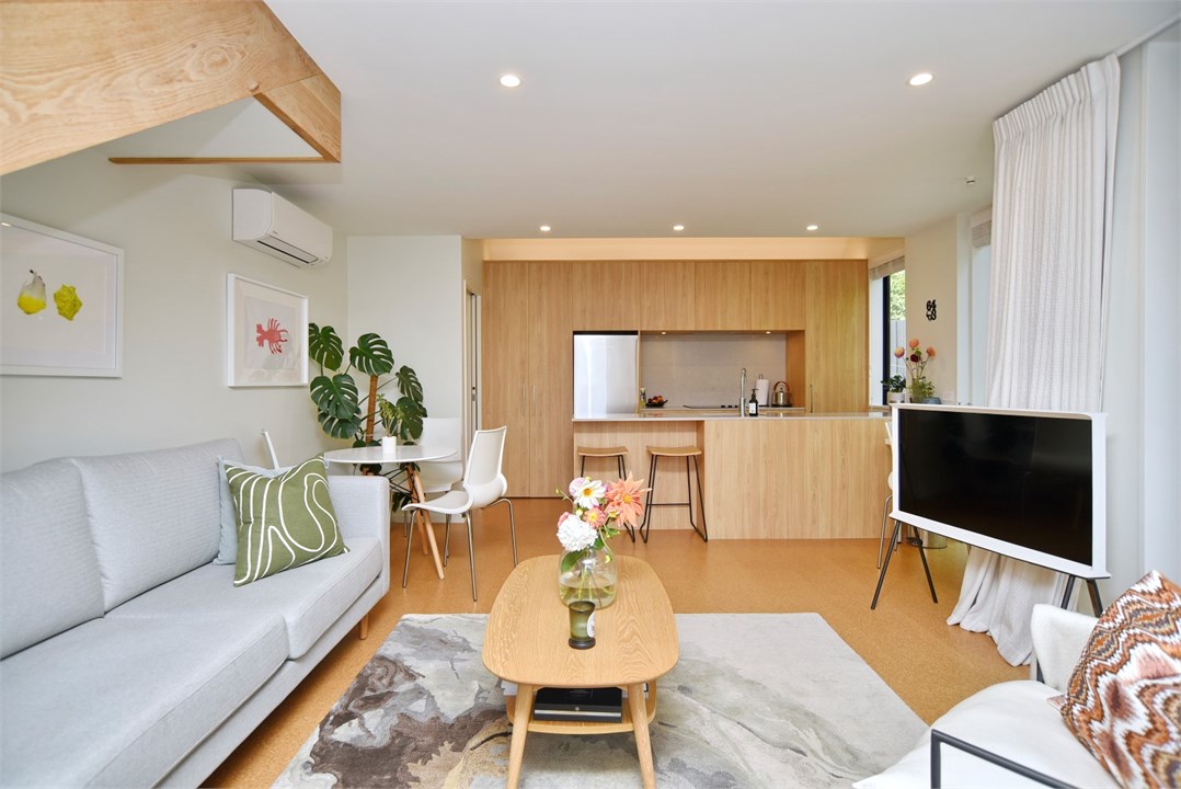 Living room with seating areas and a TV