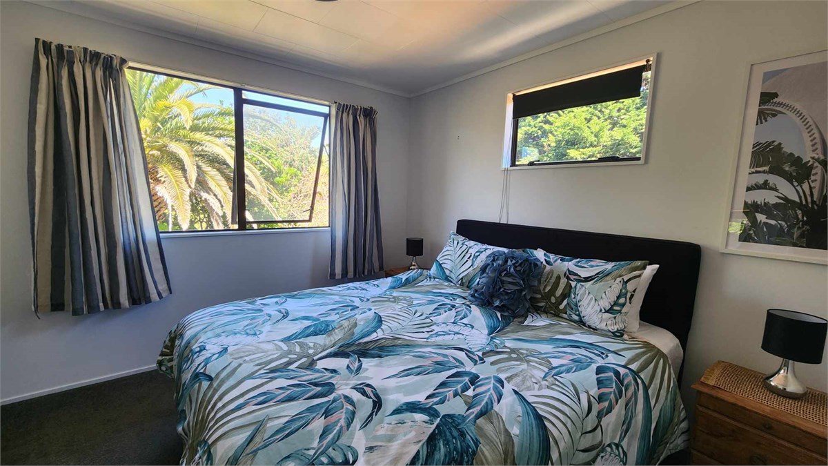Main bedroom with king size bed with a bamboo topp