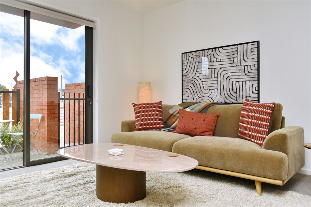 Living room has a TV and seating areas