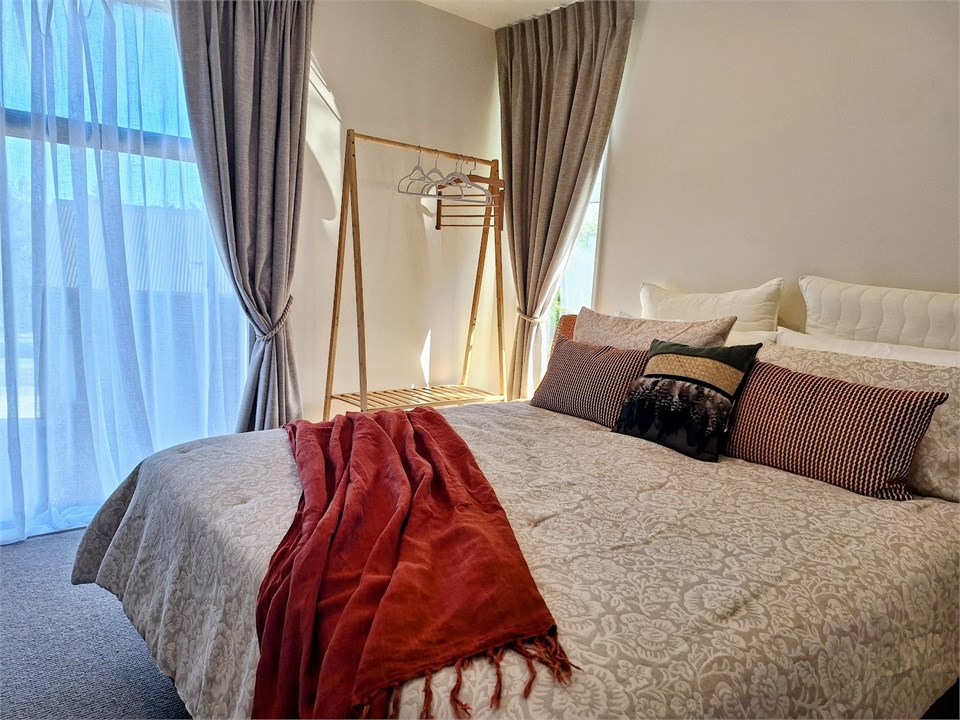 Bedroom with queen bed and bunks