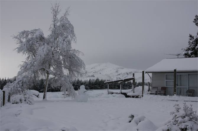 A heavy snow makes snowman making easy.
