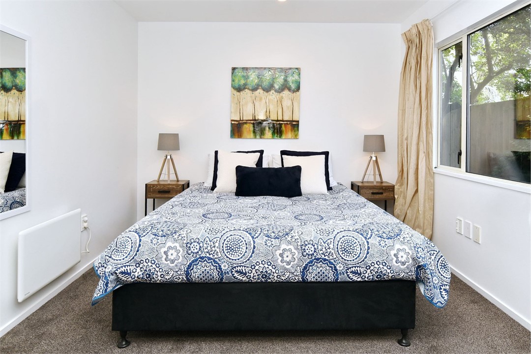 Bedroom 2, downstairs, features a King-sized bed