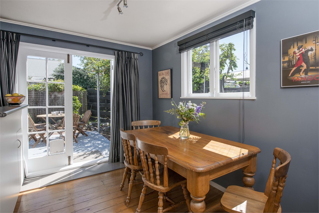 Dining area opening onto sunny private courtyard