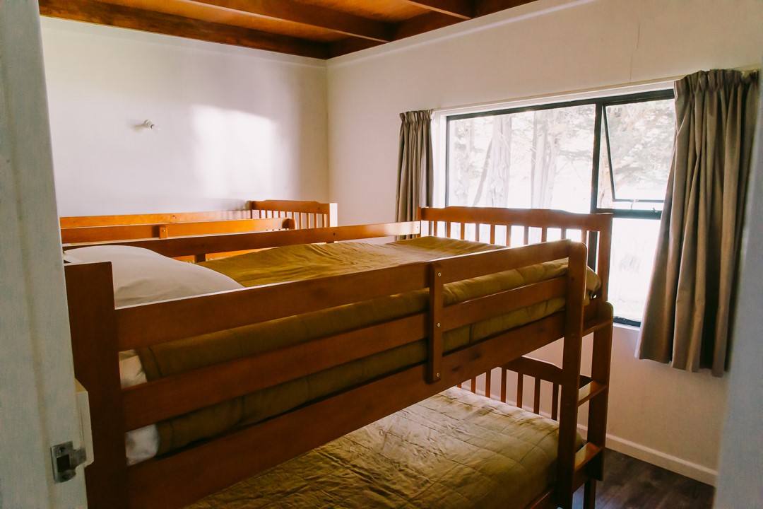 Two sets of king single bunks facing the beach