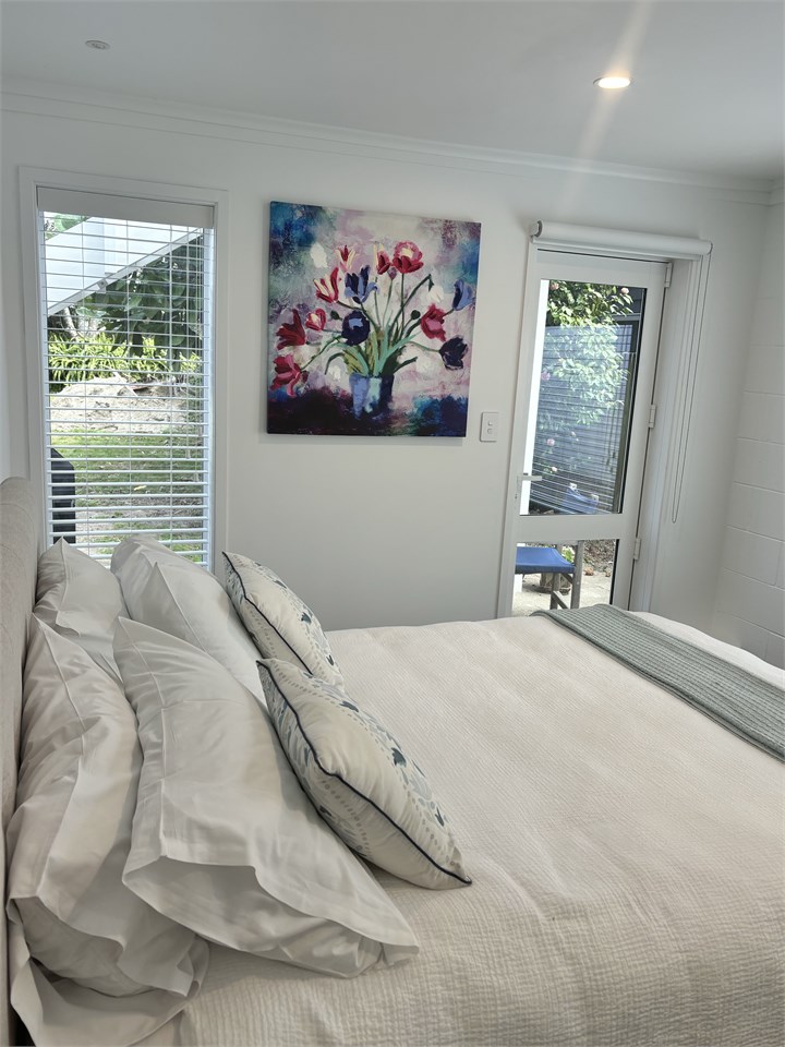 Quiet bedroom looking out onto rear garden