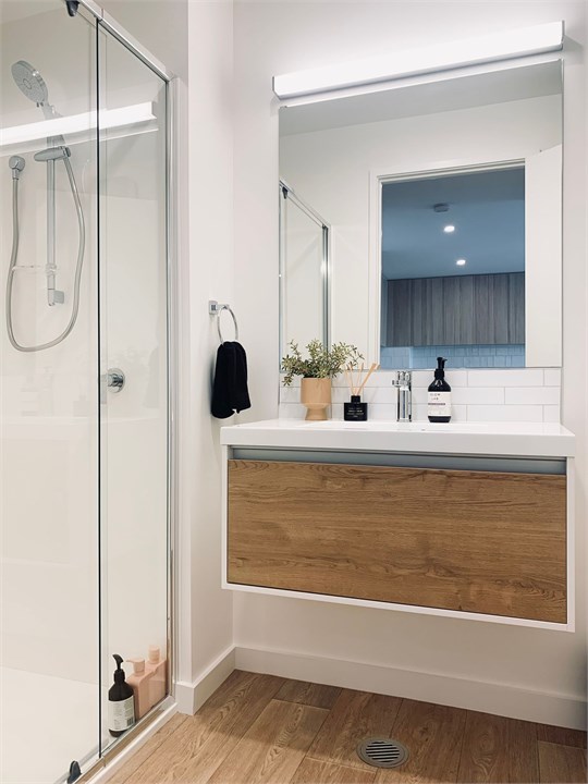 Bathroom has a shower and a toilet