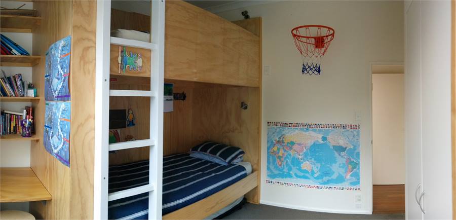 3rd bedroom with desk and basketball hoop