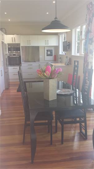View of dining room/kitchen from side french doors