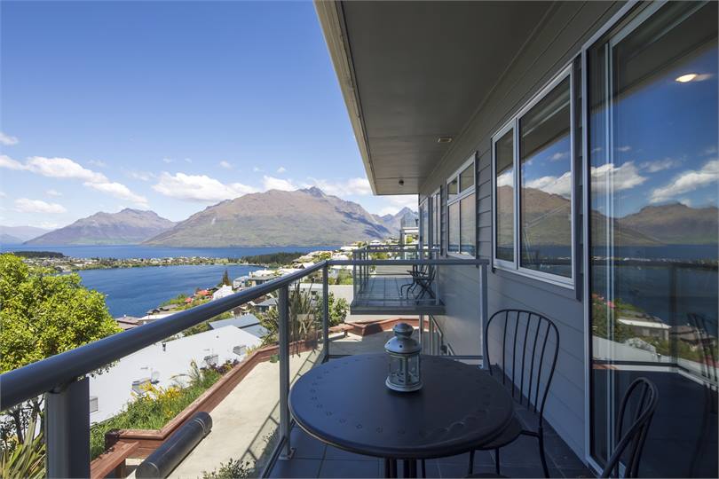 2 bedrooms have private balconies with lake views