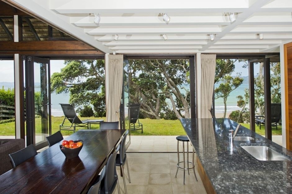 A marble Island separates the kitchen from the din