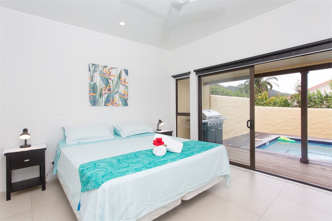 Queen bedroom with pool view