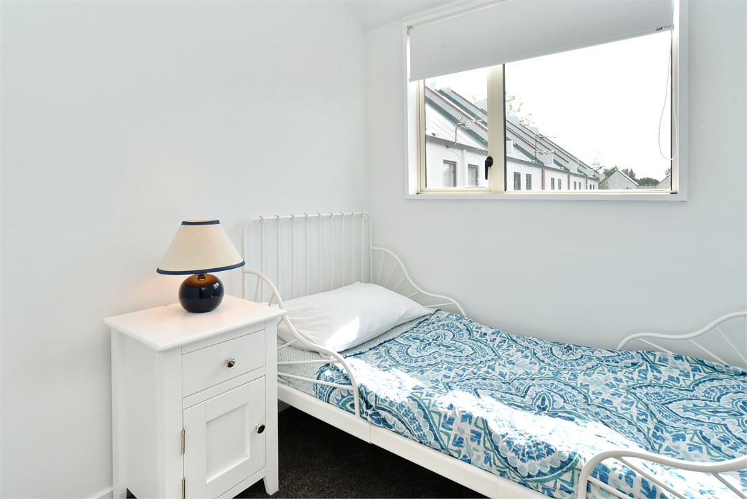 Bedroom 5, upstairs, features a small child's bed