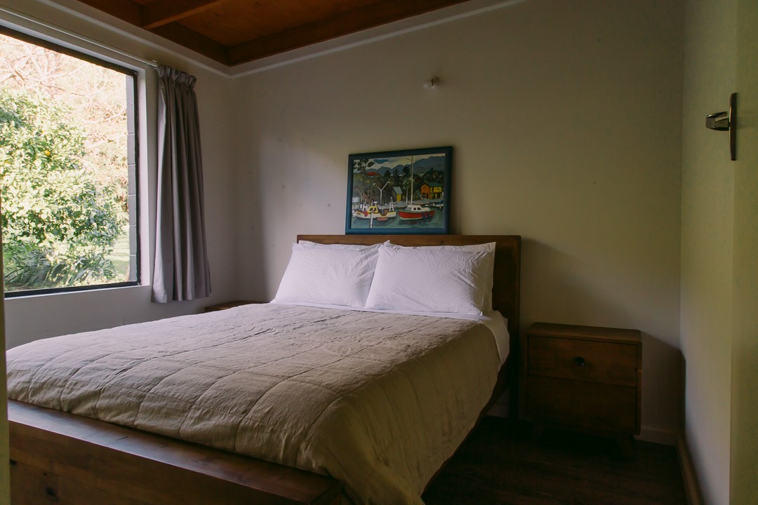 Queen size bed looking out to the farm