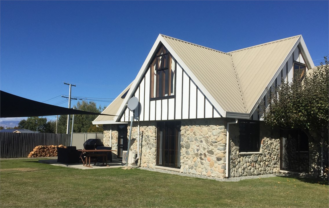 Backyard - with BBQ and outdoor seating area under