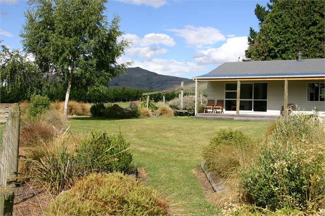 Large lawns, native gardens and a sunny deck.