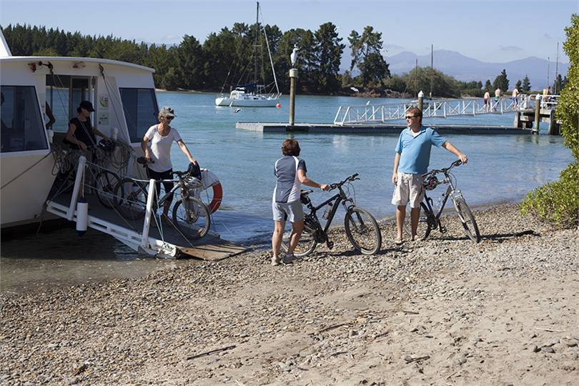 cyclists disembarking Mapua Ferry from Rabbit Is