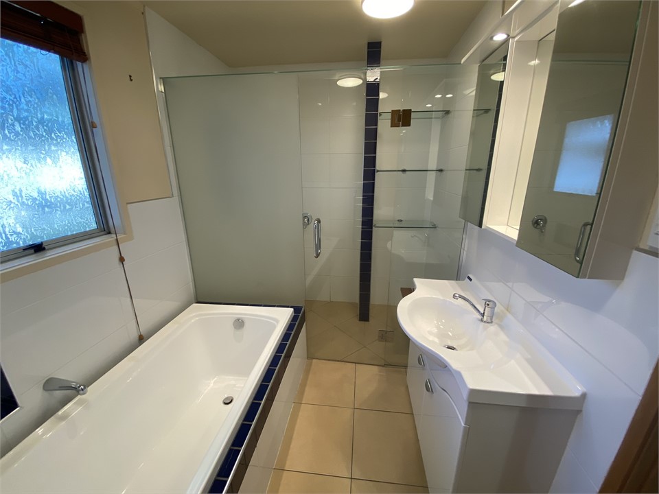 Downstairs bathroom with bath and shower