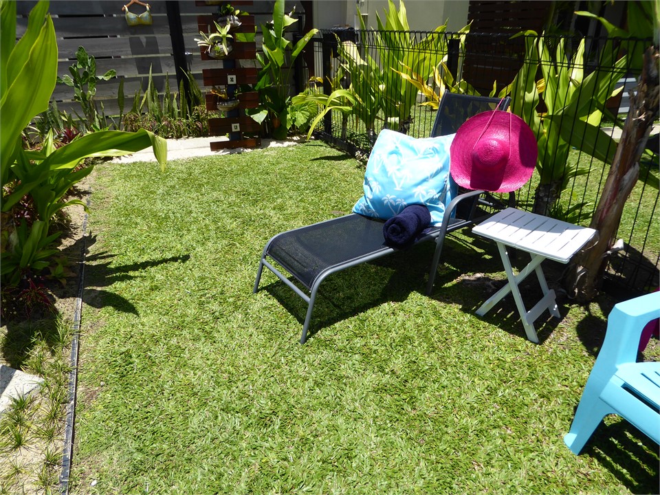 there are sun loungers and cod chairs to relax by 