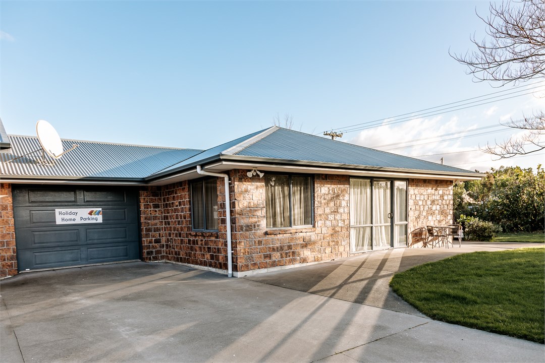 Parking in front of the single integral garage or 