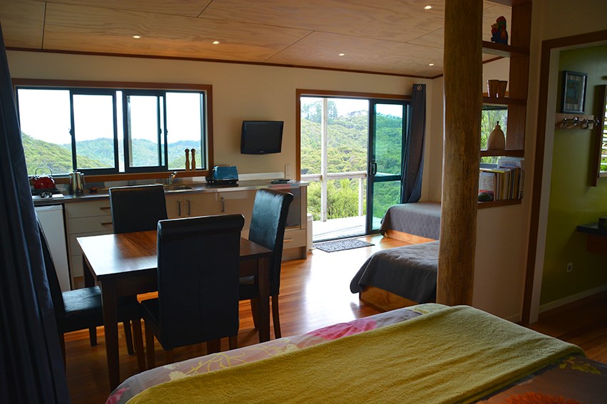 Main bed, view out to deck