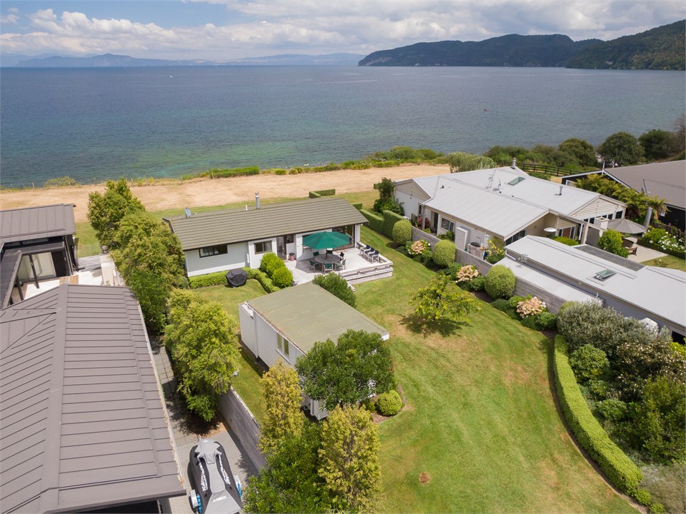 Back yard, sleep-out, house, look-out to the Lake.