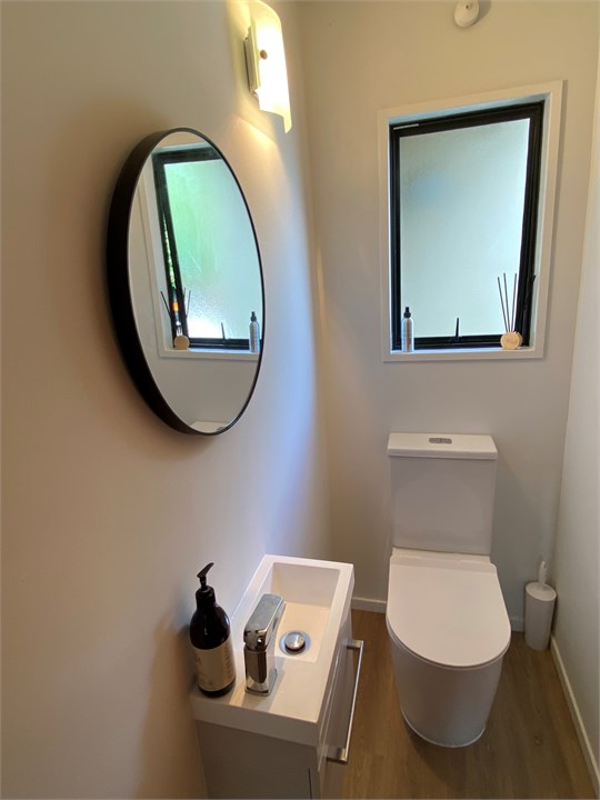 Bathroom 2 has a toilet and a shower