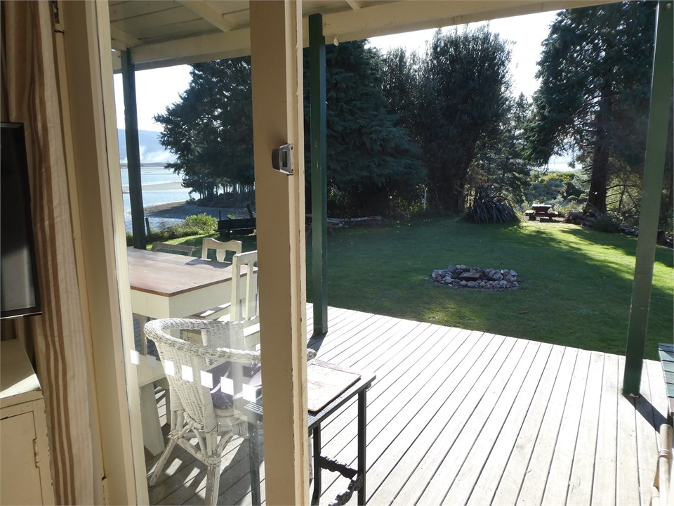 View from lounge of deck, private lawn and inlet