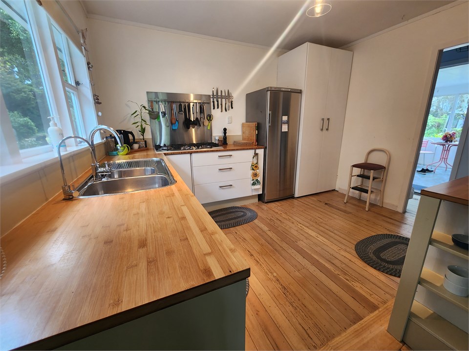 Kitchen with pantry, family size fridge and freeze