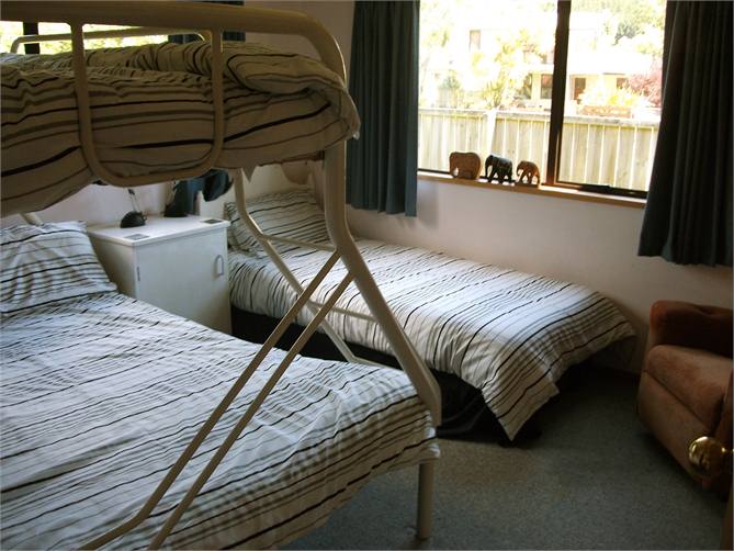 Third bedroom downstairs sleeps four 