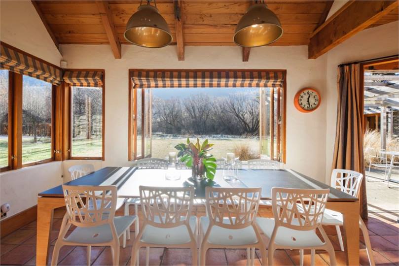 Dining with backyard and garden views