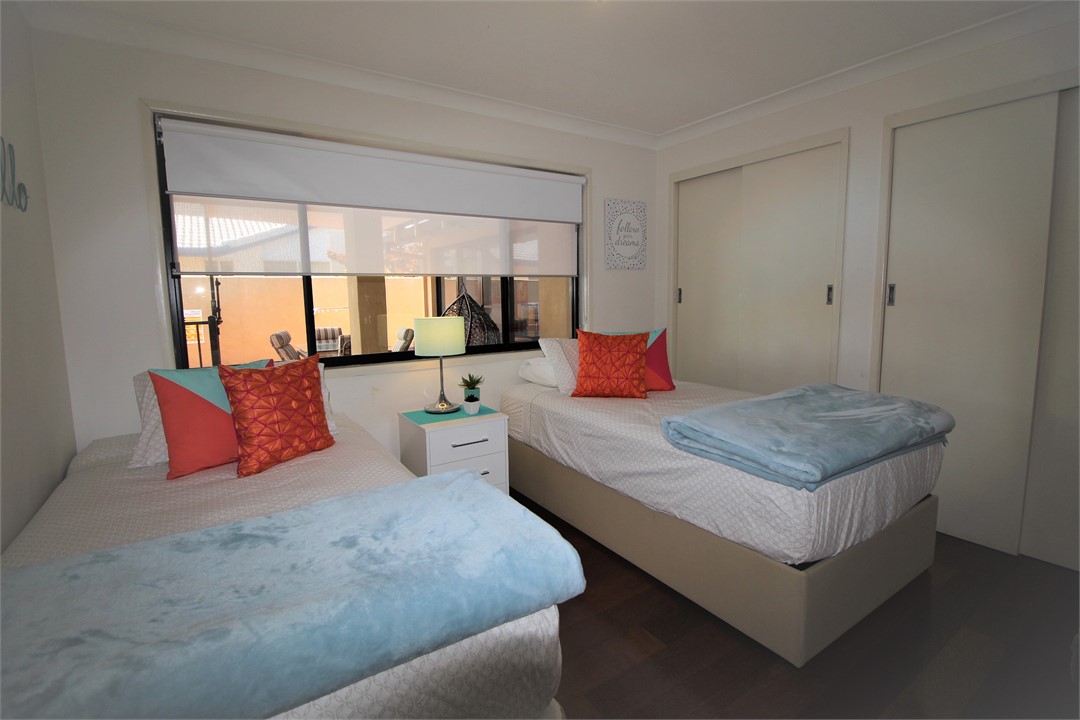 Bed 2 with Two King Singles, TV, Pool Views and Ai