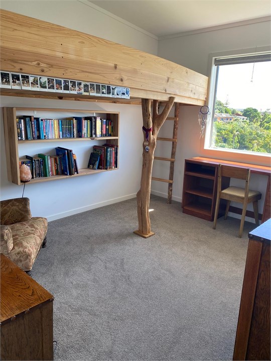 Custom single bed bunk with reading nook below.  S