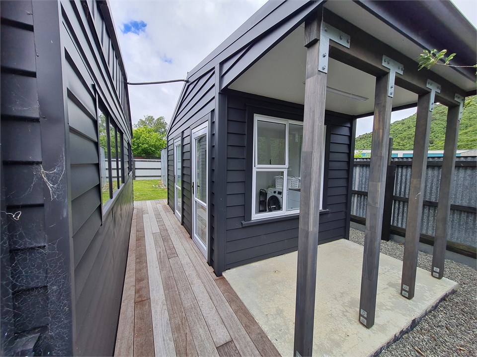 OUTSIDE BATHROOM/LAUNDRY BY SLEEPOUT AND GAMES ROO