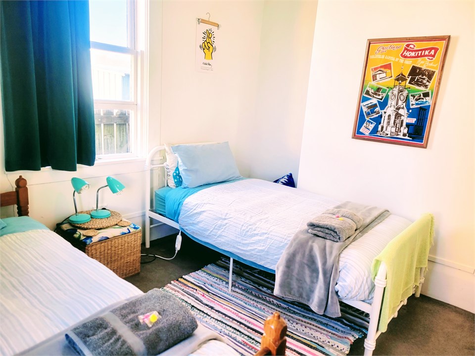 Two single beds in this room and lots of children'