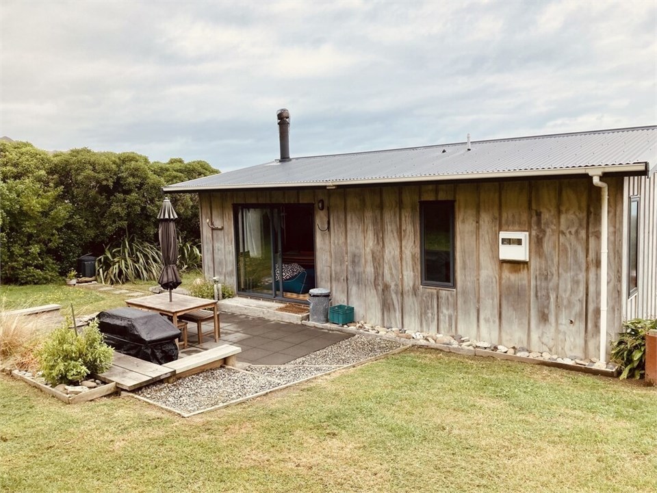 back deck with outdoor table and BBQ