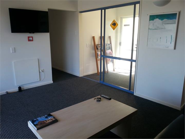 The lounge entry area with TV and Games room