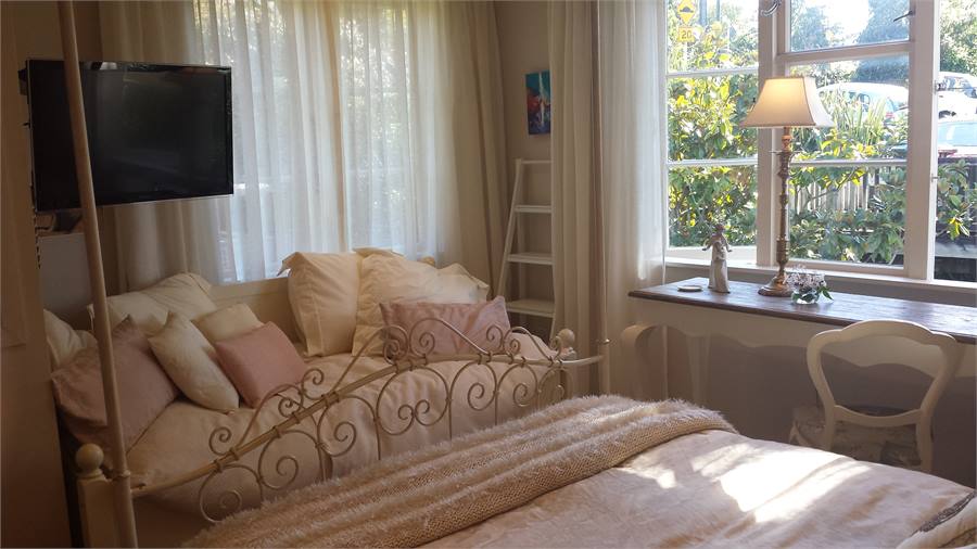 Day bed and flat screen TV in Master Bedroom