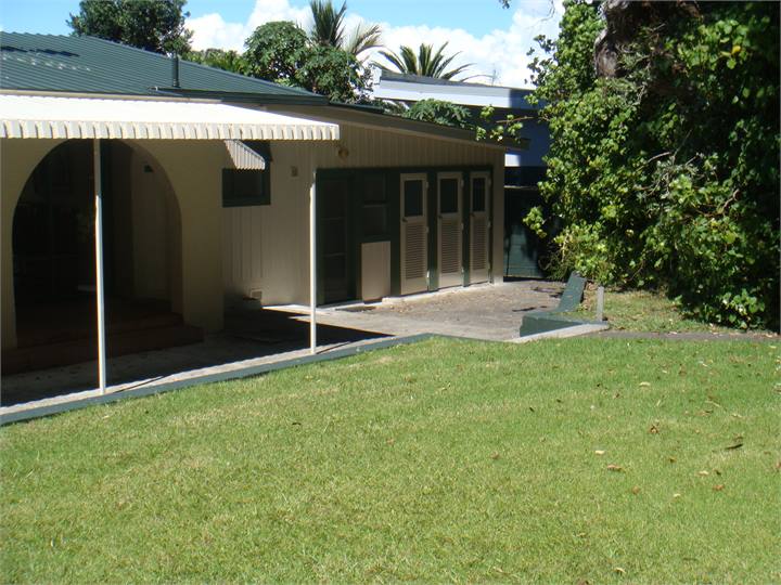 Outside toilet and two showers at rear of property