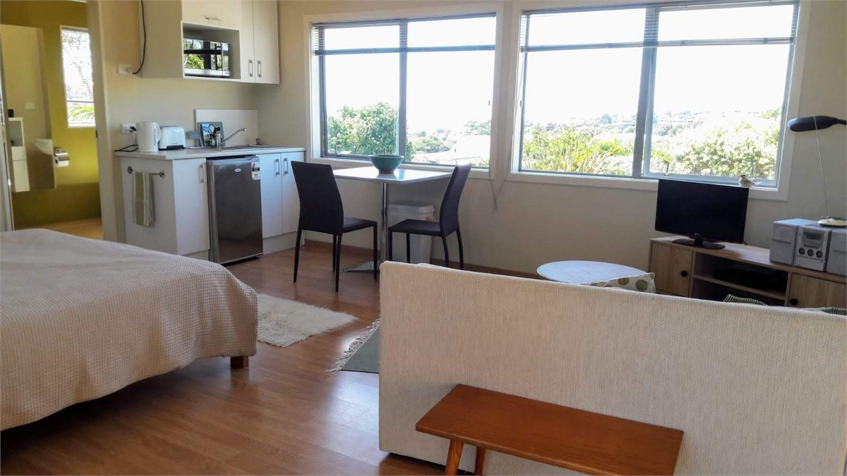 Kitchenette and windows to view of sea and estuary