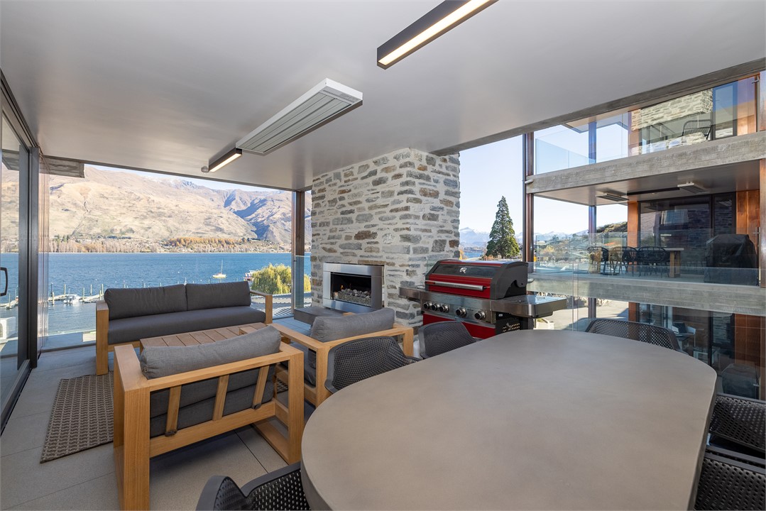 Balcony area with outside sitting and a BBQ