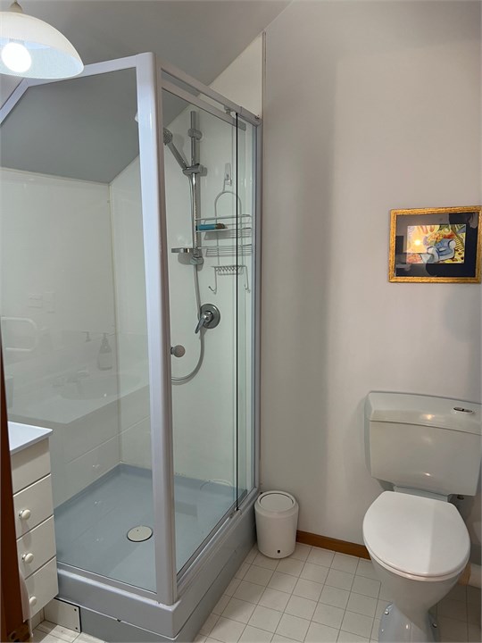 Bathroom 1 has a shower, bath and a toilet