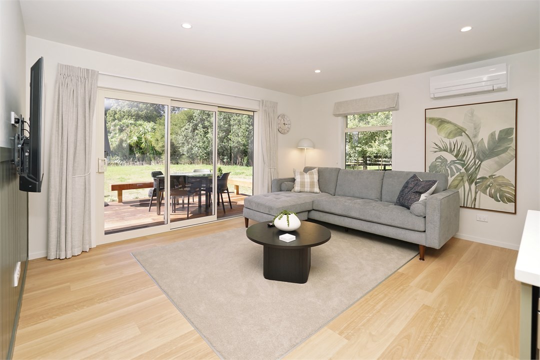 Living room has a TV and seating area