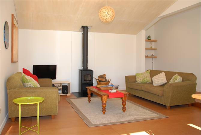 Lounge with cosy woodburner